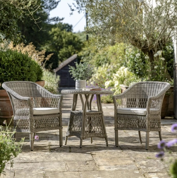 Menton rattan bistro set in garden patio setting