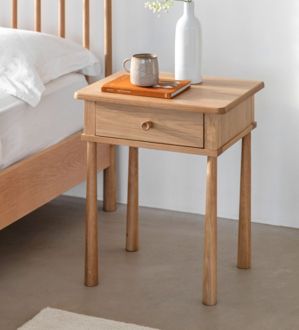 Styled bedroom scene featuring the Gallery Direct Wycombe 1 Drawer Bedside Table with Nordic oak tones and minimalist design