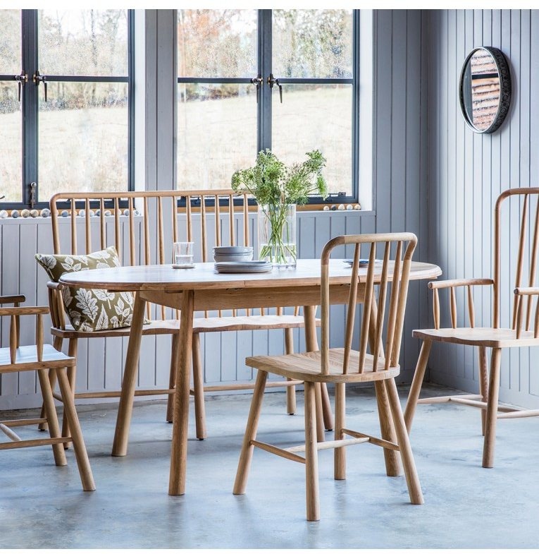 Gallery Direct Wycombe Round Extending Dining Table in a bright, modern dining setting