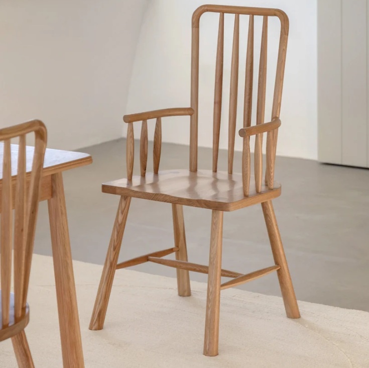 Gallery Direct Wycombe Oak Carver Chair next to dining table