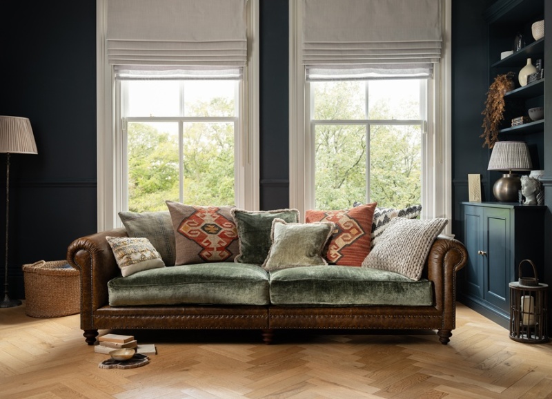 Tetrad Constable Grand Sofa in traditional room setting with wooden floor and blue panelled walls