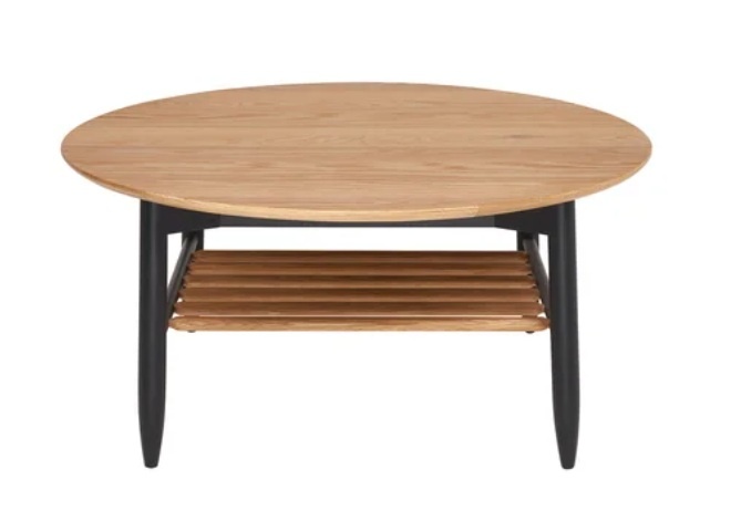 Ercol 4069 Monza Round Coffee Table in Patina Oak featuring a circular top and black spindle storage shelf - Brentham Furnitu