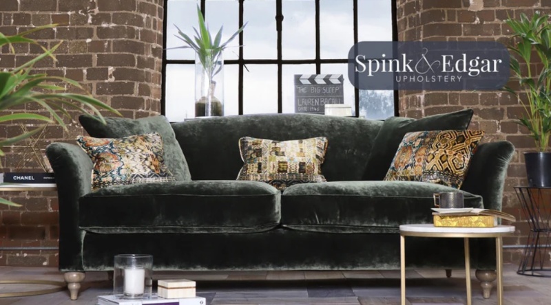 Spink & Edgar Lamour Grand sofa by Tetrad in green velvet with patterned cushions in an industrial style living room