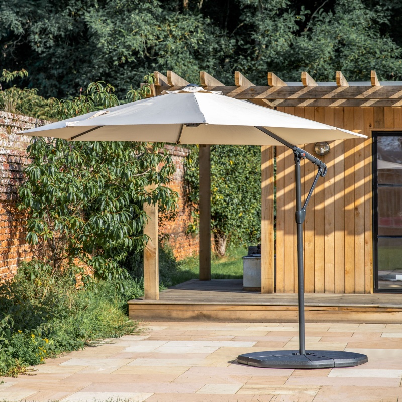 Gallery Vazzano 3m Cantilever Parasol Cream being used outside on a nice day