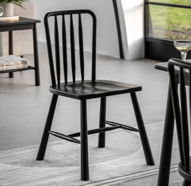 Gallery Direct Wycombe Dining Chairs in Black Oak next to dining table