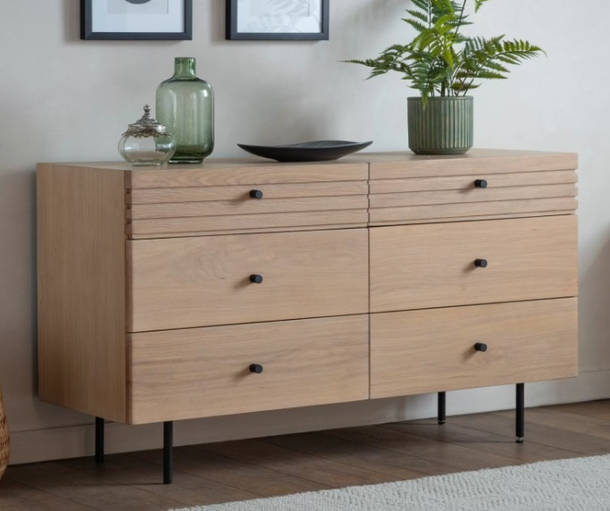 Styled interior featuring the Gallery Direct Okayama 6 Drawer Chest with oak grain detail and modern black handles