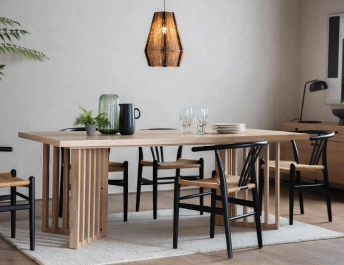Gallery Direct Okayama Dining Table styled in a contemporary dining room, showcasing oak top and chevron base