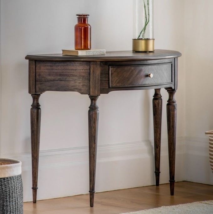 Gallery Direct Madison Demi Lune Table against a light wall in a home