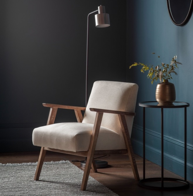 Gallery Direct Neyland Armchair Natural Linen in a blue walled room with a wooden floor