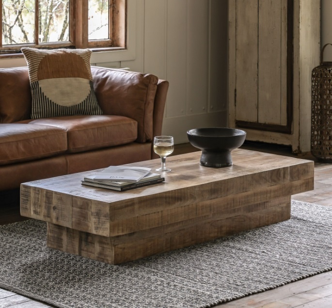 Gallery Iowa Coffee Table Natural in a cosy living room setting, showing its rustic mango wood finish & chunky block design