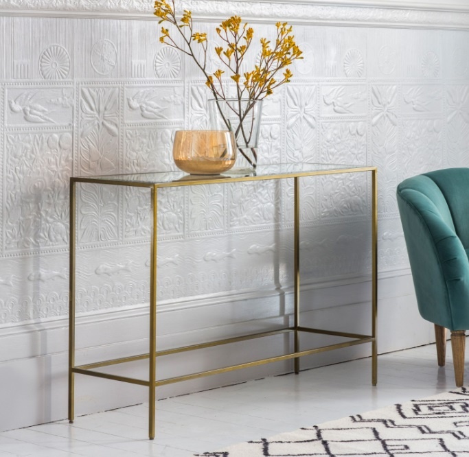 Gallery Rothbury Console Table Bronze against a white washed wall