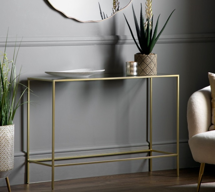 Gallery Rothbury Console Table Champagne against a grey wall in a modern home