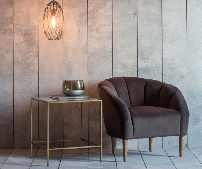 Gallery Rothbury Side Table Bronze in a panelled room next to a brown arm chair