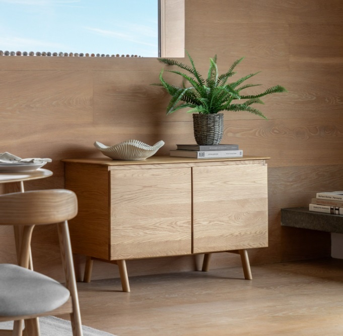 Gallery Direct Madrid 2 Door Sideboard Oak styled in a warm interior, showcasing its minimalist mid-century design