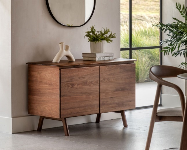 Gallery Direct Madrid 2 Door Sideboard Walnut styled in a modern room with tapered legs and rich mid-century walnut finish