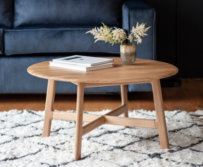 Gallery Direct Madrid Round Coffee Table Oak in a modern living room setting