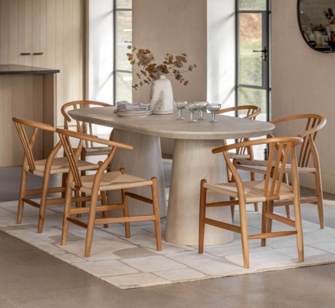 Gallery Pedra Oval Dining Table Travertine in a contemporary dining space