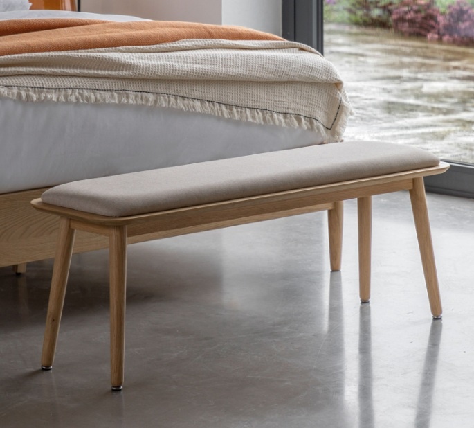 Gallery Hatfield Bench Natural at the foot of a bed in a modern home
