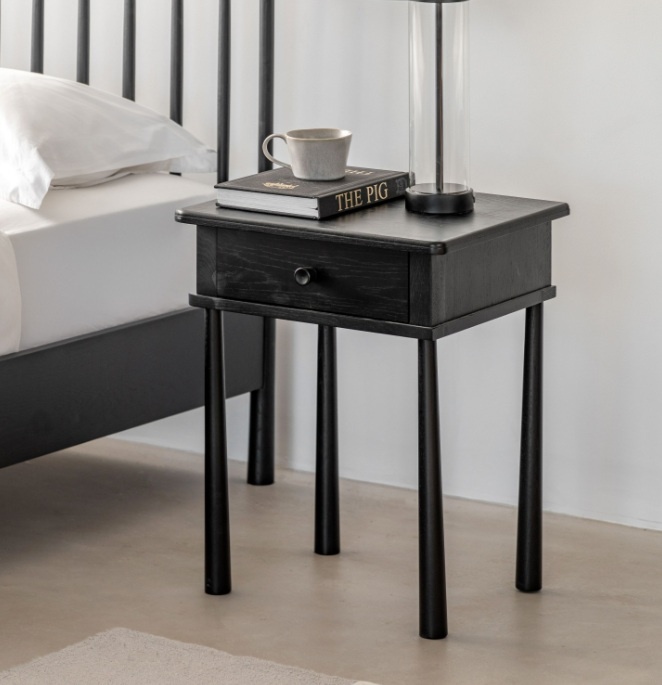 The Gallery Direct Wycombe 1 Drawer Bedside Table Black styled beside a bed with modern black oak finish and practical drawer