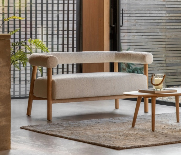 Modern living room featuring the Gallery Direct Acera Sofa with curved design, cream upholstery and solid ash wood legs