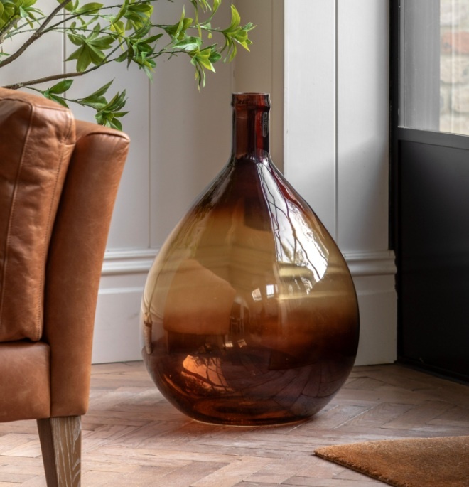 Rueda Giant Glass Bottle Vase Amber in a modern home