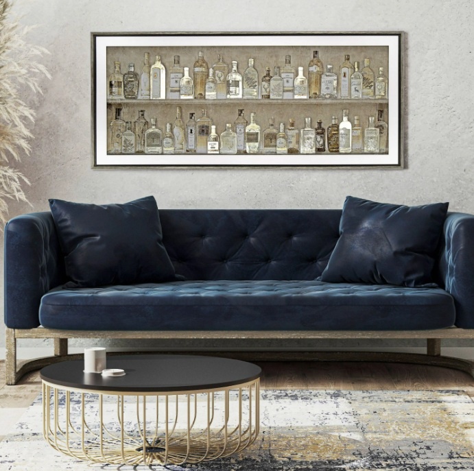 Gin Collection Framed Art above a blue sofa in a home