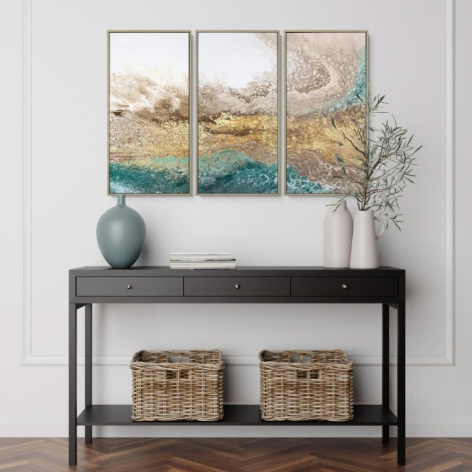 Serene triptych framed canvas wall art displayed above console table in modern living room