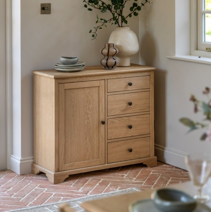 Gallery Direct Malvern Sideboard in kitchen against wall with clay stone floor tiles & flowers