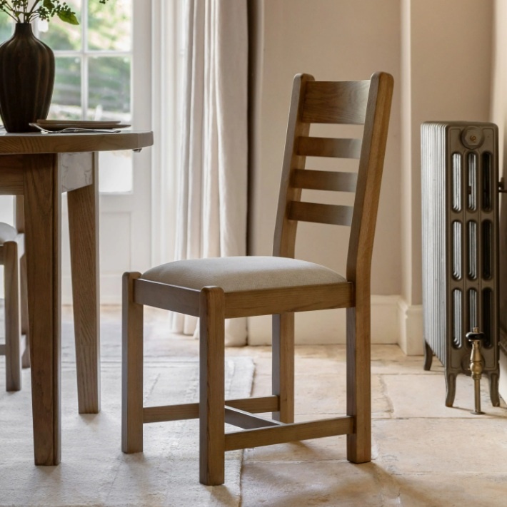 Gallery Direct Hardwick Dining Chair (Set of 2) in kitchen next to a table and victorian styled radiator on cream rug