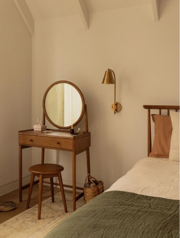 Ercol Salina 2107 Dressing Table Stool in Vintage Ash in a traditional bedroom setting