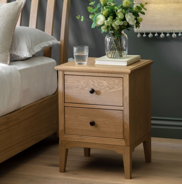 Gallery Direct Malvern 2 Drawer Bedside in bedroom next to bed with vase on top