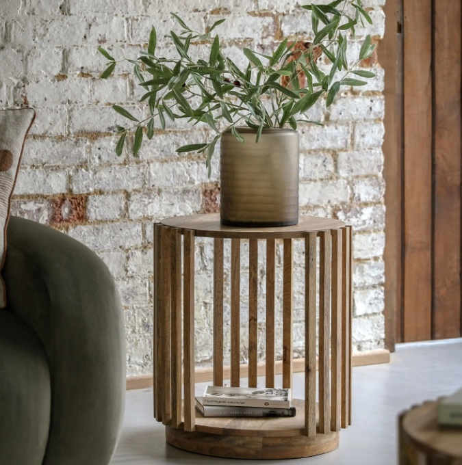 Gallery Direct Voss Side Table against a white washed brick wall