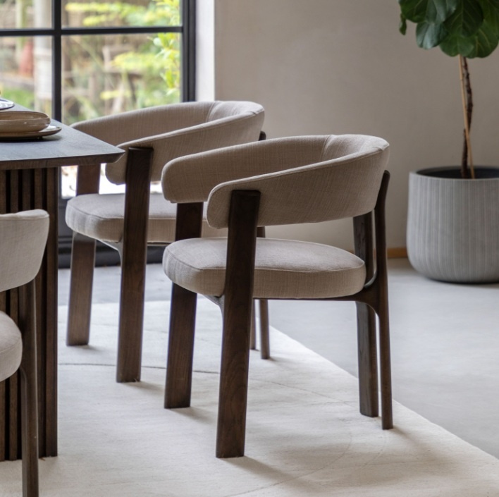 Gallery Direct Onda dining chair in natural fabric and walnut frame styled in dining room