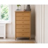 Ercol 2685 Teramo 6 Drawer Tall Chest in modern bedroom with white walls and rug