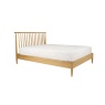 Ercol Teramo 2681 kingsize bed in solid oak angled view with spindle headboard