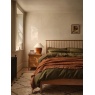Ercol Teramo 2681 kingsize bed in styled bedroom with oak bedside table and warm neutral decor