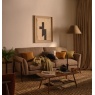 Ercol 4330/3 Forli Medium 2.5-seater sofa in earth-toned fabric with Dark Wood (DK) legs. Shown in a rustic-minimalist living