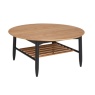 Ercol 4069 Monza Round Coffee Table in Patina Oak featuring a circular top and black spindle storage shelf - Brentham Furnitu