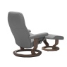 Stressless Consul leather recliner in a fully reclined position showing the Plus system lumbar and headrest support