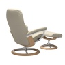 Rear angled view of Stressless Consul signature base recliner showing the elegant wood trim and polished aluminum finish