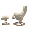 Side profile of the Stressless Mayfair Signature recliner and footstool in Paloma Beige leather, demonstrating the Plus™ Syst