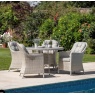 Gallery Direct Holton 4 Seater Round Dining Set next to swiiming pool on stone patio