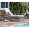Gallery Menton Country Lounger Stone rattan garden chair by swimming pool