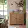 Gallery Direct Malvern 1 Door 4 Drawer Sideboard compact sideboard in light oak wood rustic with vase & flowers on top