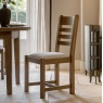 Gallery Direct Hardwick Dining Chair (Set of 2) in kitchen next to a table and victorian styled radiator on cream rug