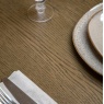 Gallery Direct Hardwick Extending Dining Table close up of table top showing rich brown wood grain