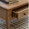 Gallery Direct Malvern 1 Drawer Coffee Table on soft stylish rug with drawer open showing runners