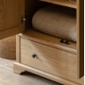 Gallery Direct Malvern 2 Door 1 Drawer Wardrobe in bedroom with blankets folded up inside robe