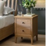 Gallery Direct Malvern 2 Drawer Bedside in bedroom next to bed with vase on top