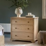 Gallery Direct Malvern 3 Drawer Chest in bedroom with white vase and flowers on top